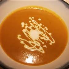 Creamy Pumpkin Soup Topped with Curried Pecans